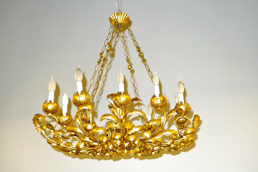 Exquisite oblong chandelier suspended by four chains attached to a central canopy with 10 candle bulb sockets. Tole is in the form of Peonies and acanthus leaves