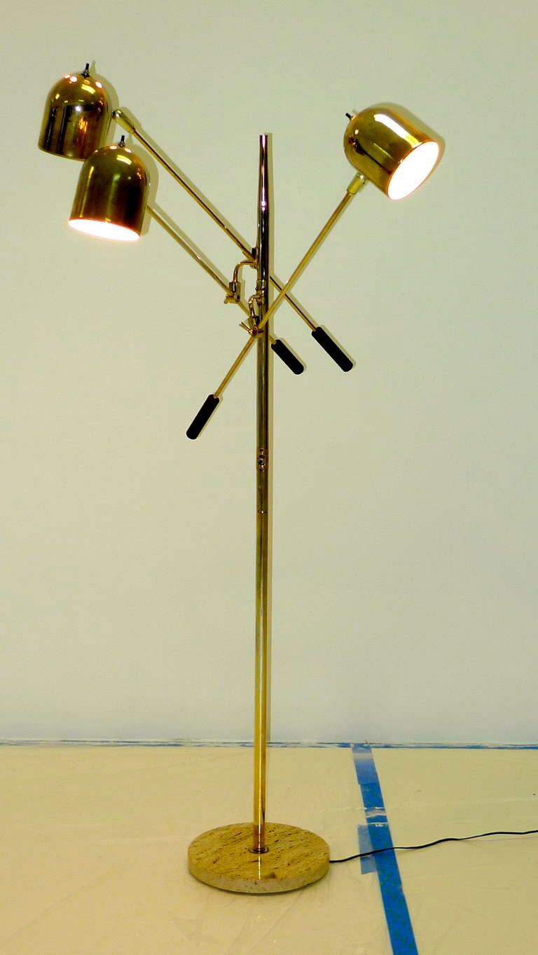 Vintage 1960's Italian floor lamp with three articulating arms and a round brass marble base.  Metal is brass finished or brass plated steel to a mirror finish.  Some wear to brass finish on shades. Italian marble base.  Each light head has its own