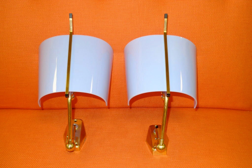 Versatile pair of Italian 1950's wall sconces by Stilnovo.  Marked with label inside and engraved 