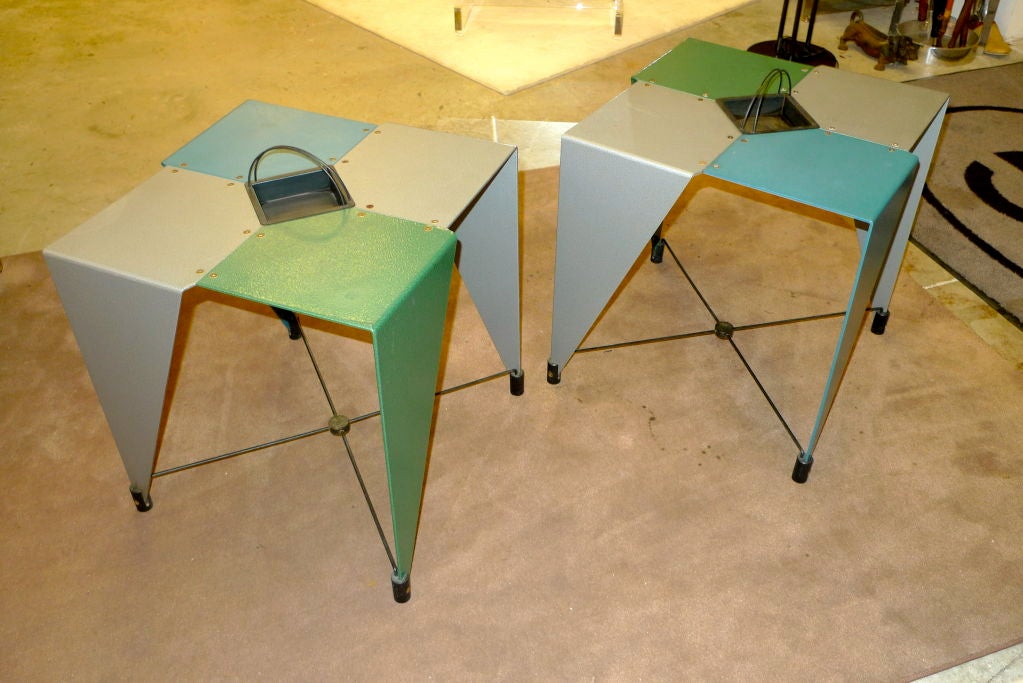 Whimsical pair of vintage side tables marked 'errebi' consisting of four geometric cut shapes of powder coated plate aluminum in grey, green and blue with a shallow jardiniere.

The design reminds me of the guerilla art project by Martino Gamper