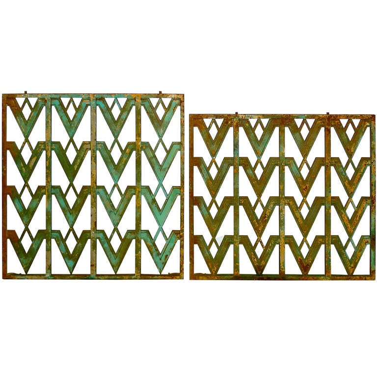 Original unrefinished cast iron architectural grate or grille embellished by a stylish pattern of repeating 