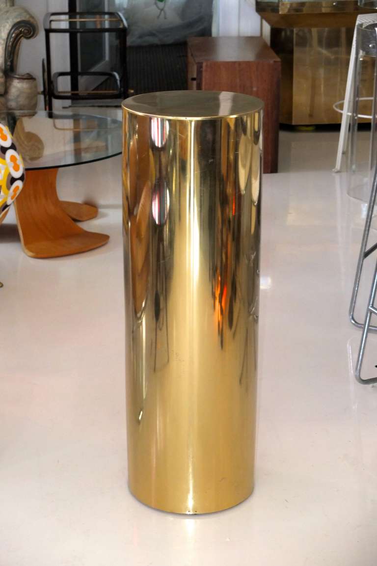 Vintage brass pedestal column by Curtis Jere, signed.

Great for a blingy plant stand or base for a sculptural object.

We have two more C. Jere brass drum pedestals, the top of which is illuminated rather than brass.