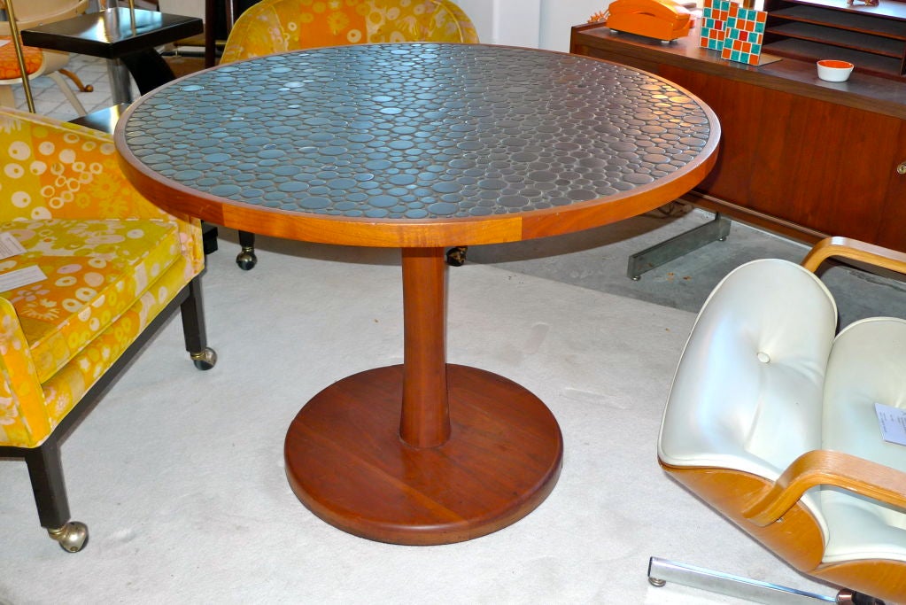 dining table with glass top and pebbles