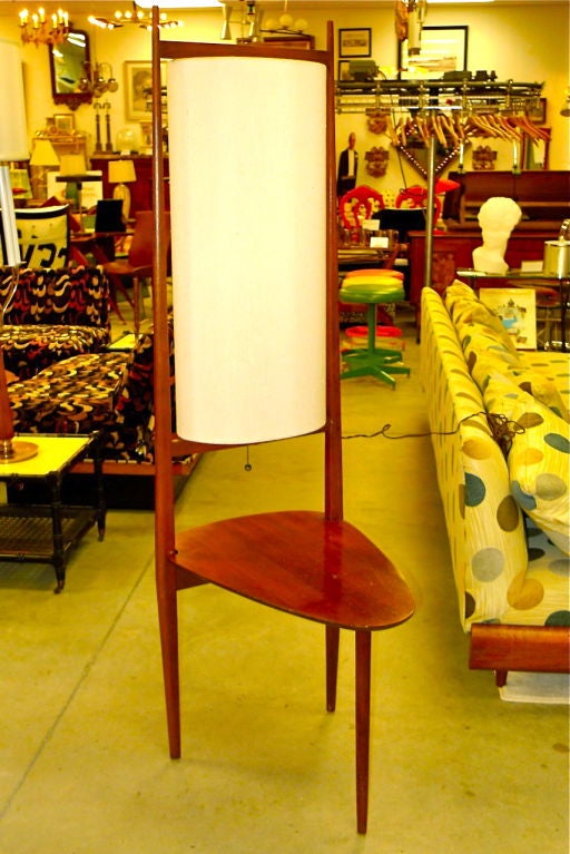 Graceful modernist table and lamp combo with original organic rag paper cylinder shade.  Legs have a delicate taper and table top is like an elongated guitar pick. Possibly a studio piece.