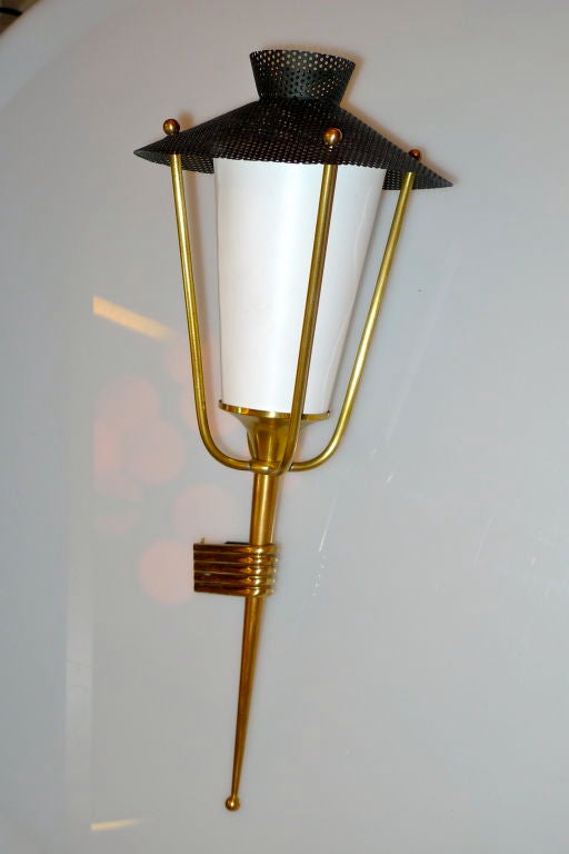 French 1950's lantern sconce produced by Arlus, France; design attributed to Mathieu Mategot.<br />
<br />
This sconce is intended to be mounted in a corner where two walls meet at the perpendicular 45 degree angle.<br />
<br />
Please note