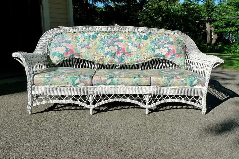 These wicker items are being sold as an ensemble at a special price. To purchase individually refer to their unique listings for the single item list price.

Antique Wicker Sofa USA, Early 20th Century Antique white wicker sofa, the paradigm of