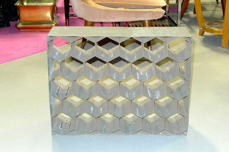 An interesting piece of industrial re-purposing made of galvanized metal with 28 hexagonal slots perfect for storing wine bottles or even just as a sculptural item which casts intriguing shadows resembling the tumbling blocks motif.