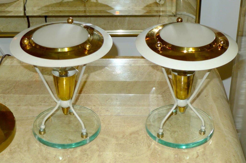 Pair of atrikingly stylish Italian 1940's boudoir lamps.

Each can take up to one 60 watt candle socket bulb, allowing for generous illumination.