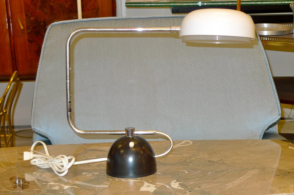 Articulating desk lamp designed by Robert Sonneman for Robert Sonneman Associates, Inc. Label on underside indicated model name and number TAK 7702.  Produced in Japan. 40watt bulb.  Entirely original. Robert Sonneman decal on chromed arm.