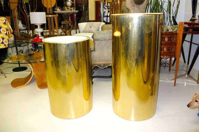 Two illuminated brass pedestal bases with frosted glass tops.  Can be used as plant stands, column bases for displaying glass or sculpture or even as side tables. Both signed C. Jere.

Each base takes a single Edison screw bulb or spot/flood light