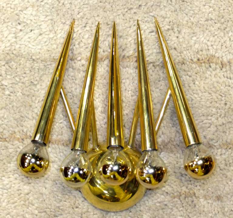 Most unusual but extremely well constructed Italian 1950's wall sconce consisting of a half sphere mount and five ling tapered inverted cones with pointed ends directed towards one another almost in salute. Possibly Stilnovo but most definitely an