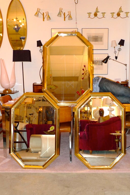 We now have only one of these lovely polished brass framed and beveled glass wall mirrors in elongated octagonal shape.  
Imported from Italy by Decorative Crafts.

