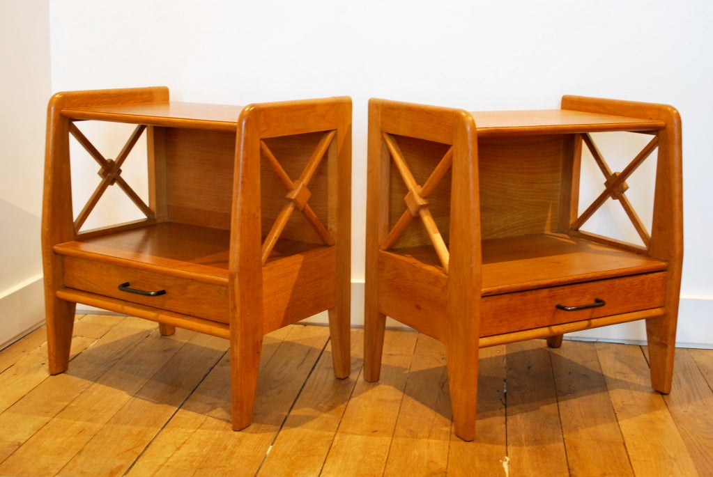 Pair of French 1940's night stands, in light oak with signature Jacques Adnet braced 