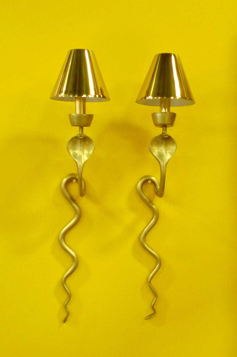 Pair of French brass sconces in form of a cobra, newly electrified with vintage metal shades. Converted from candle sconces.