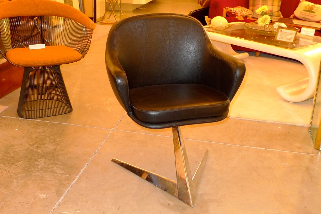 Incredibly handsome single chair for dining, desk or occasional seating with dramatic Star Trek base and faux leather armchair.  These were designed as a special private commission by the President of Air France in 1958 for the Executive Boardroom. 