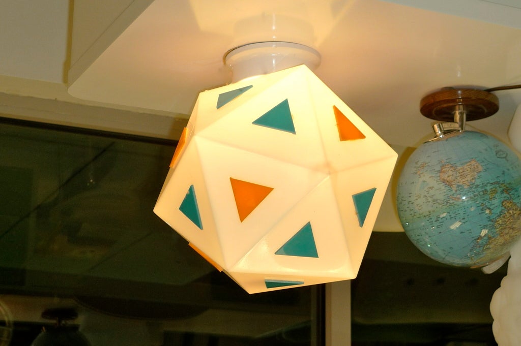 Genuine treasure from America's highways, we have three of these vintage white glass globes from a Burger Chef restaurant.  Each globe is an icosahedron (20 triangular sides) with one side serving as the 4 inch opening for the mounting hardware.