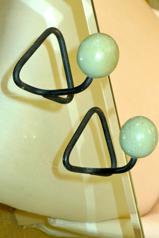 Cutest vintage 1950's French coat hooks in the style of Jean Royere in triangular form made from a single length of blackened iron and capped with an wooden ball in original spearmint green old paint.  Also available separately is a similar double
