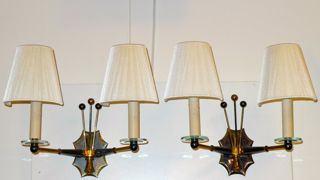 Amazing collection of sconces, ten in total (sold in pairs) from Maison Jansen, circa 1950's, in the manner of Gilbert Poillerat.

Price shown is per pair.