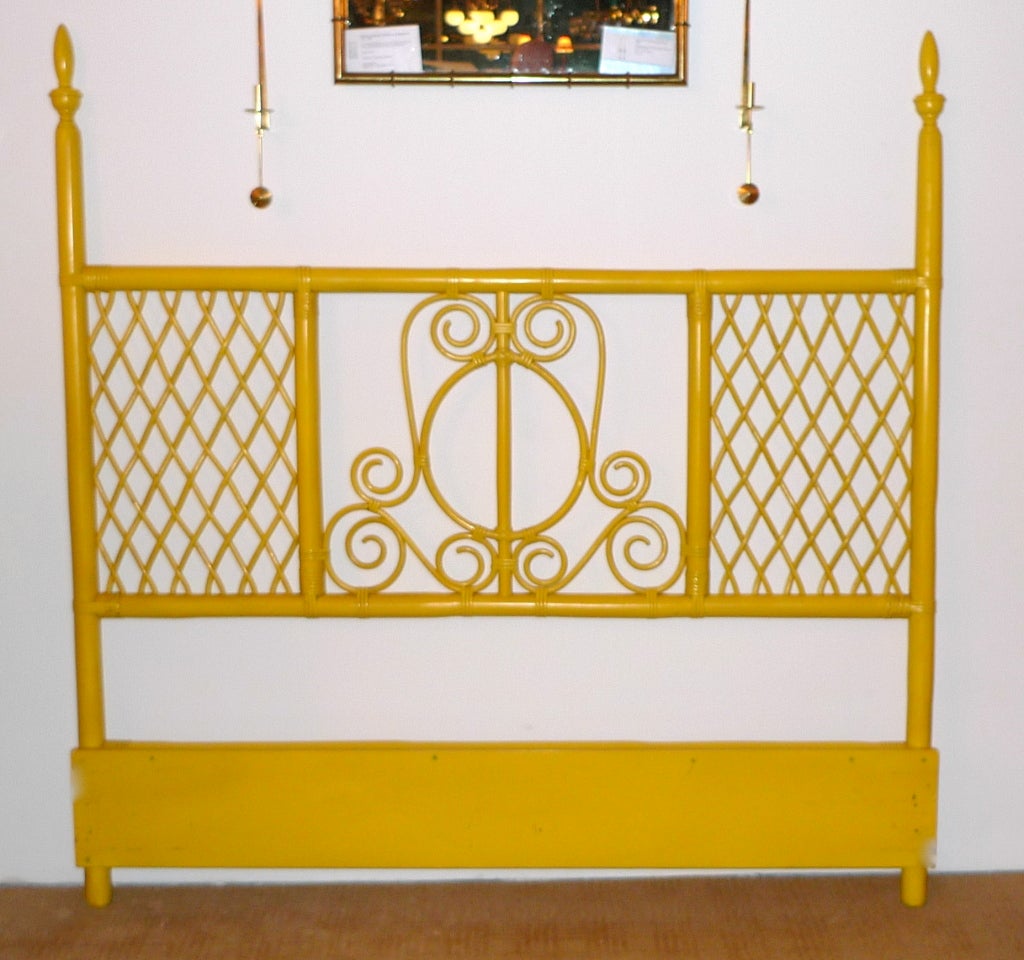 This is the original factory yellow paint on this early 1960's Queen size headboard by Willow & Reed.  Scrolls and criss-crossed lattice reed in a faux bamboo frame.  Cheerful and fun.