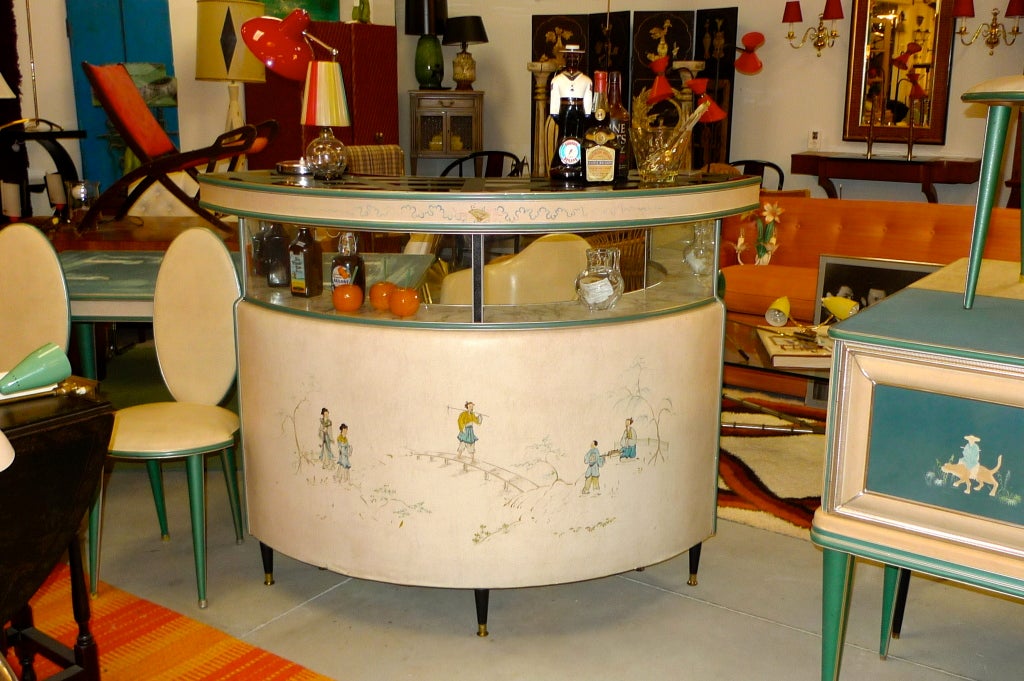 A 1950's Italian curved standing bar by Umberto Mascagni of Bologna.  Retailed through Harrod's London 1952-1955. Bar is sheathed in Skai, a faux leather, with silk screened Asian figures in a pastoral landscape.  Bar is illuminated under the