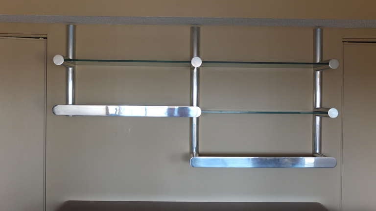 Rarer than hens' teeth I've been stalking this ORBA wall system for years. Sublimely fine design and metal skills.  Cast tubes of polished aluminum fit together horizontally and vertically so the joints seem seamless.  Each bottom shelf is fitted