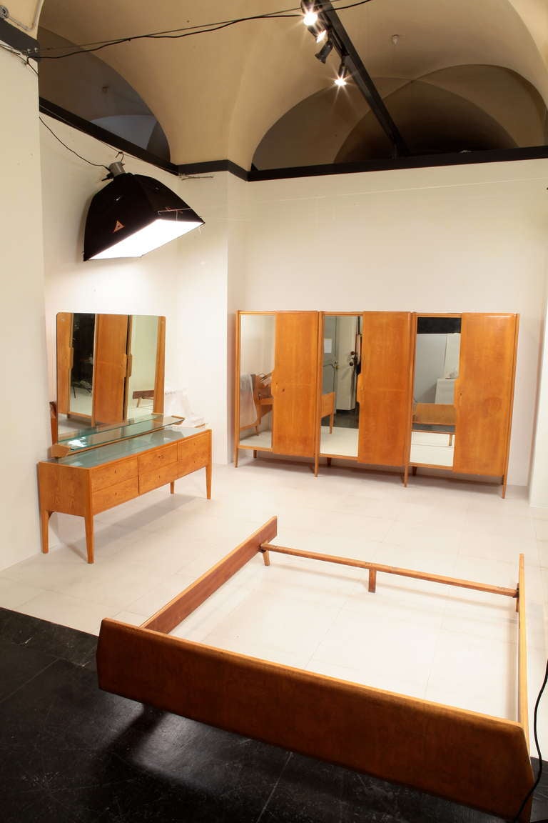 A large Gio Ponti armoire wardrobe from 1957 made of ash veneer and three doors with three large mirrored panels and integral lighting system inside.

Certificate of Authenticity from the Gio Ponti Archives

See BG's separate listings for the