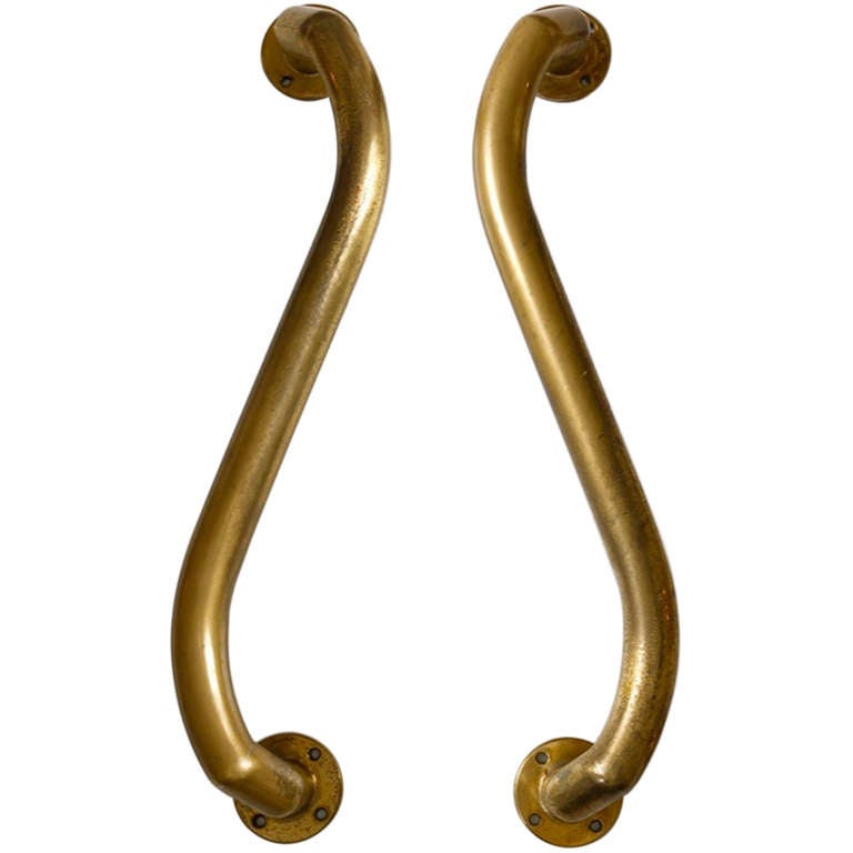 Amazing large-scale double-pair of Italian Art Deco door handles or pulls in serpentine form.

Their shape, scale and form prefigure designs by Nanda Vigo from the late 1980s.

The bronze tubular handle itself is just under 1-1/2 inches