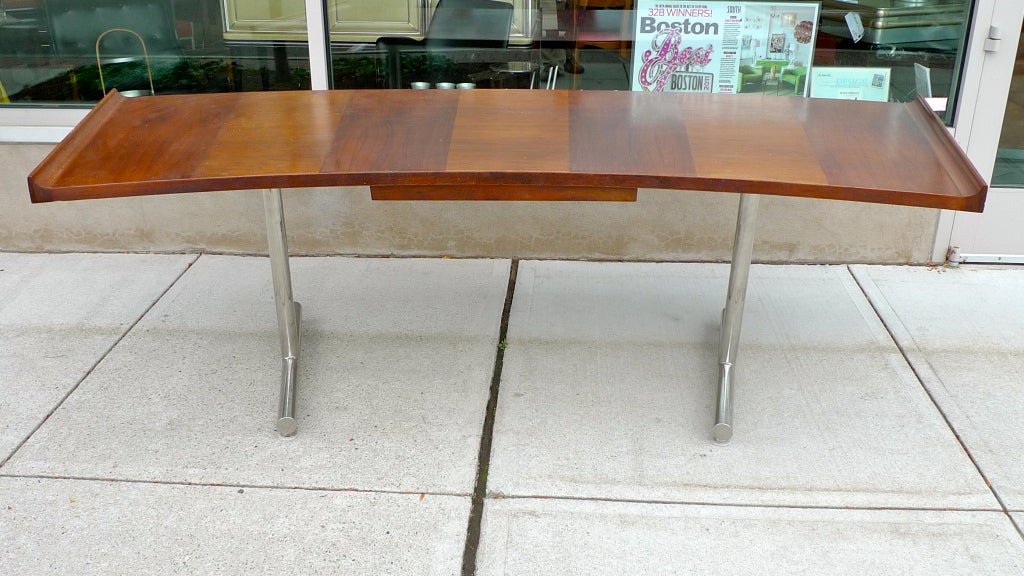 Impressive and monumental seven foot curved top desk by Harvey Probber with double L shaped tubular chrome legs with integral end caps.  Desk top has upswept curved left and right edges,  Also has a single sliding draw
