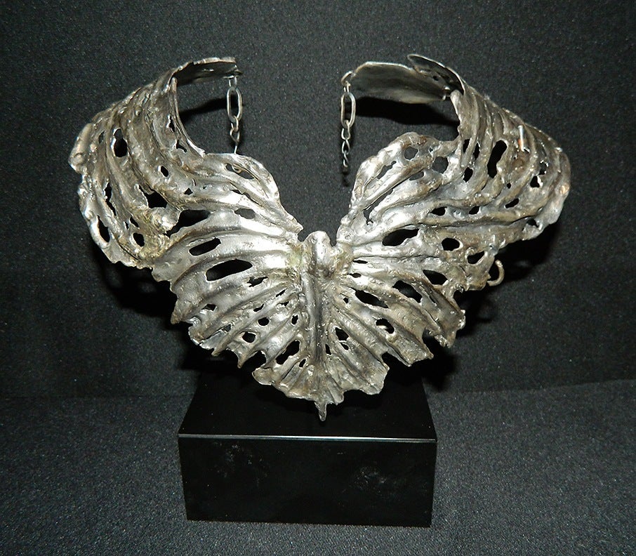 Judith Brown signed sculpted collar in sterling silver (11.86 ozt).
Channel your inner Isis and Aphrodite!

From her New York Times obituary May 15, 1992:

Using scrap and shaped steel and junkyard objects, Ms. Brown produced works that ranged