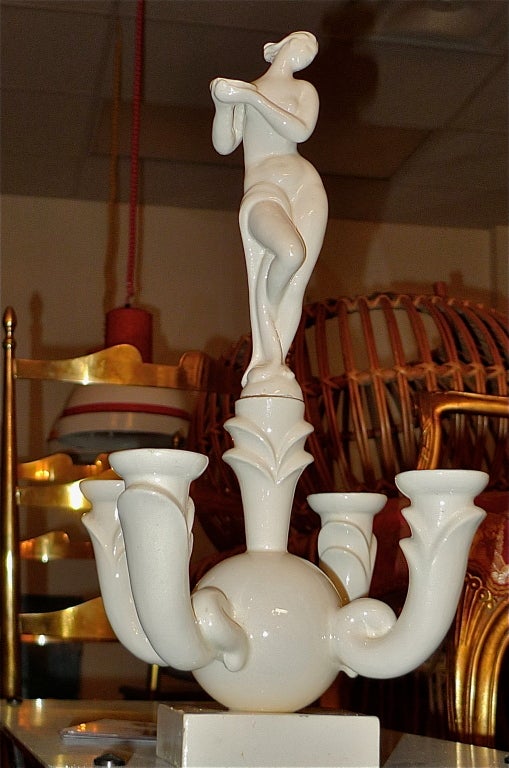 Stunning white ceramic stylized art deco four candle candelabra centerpiece, unsigned.  Female nude holding bowl recalls some of the designs by Gio Ponti for Richard Ginori.  Uber chic.