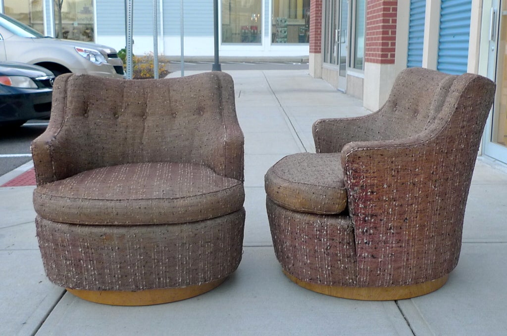 Pair of barrel back swivel chairs by Edward Wormley of Dunbar for Modern,  Blonde wood plinth base. 

Price includes reupholstering in your own fabric.