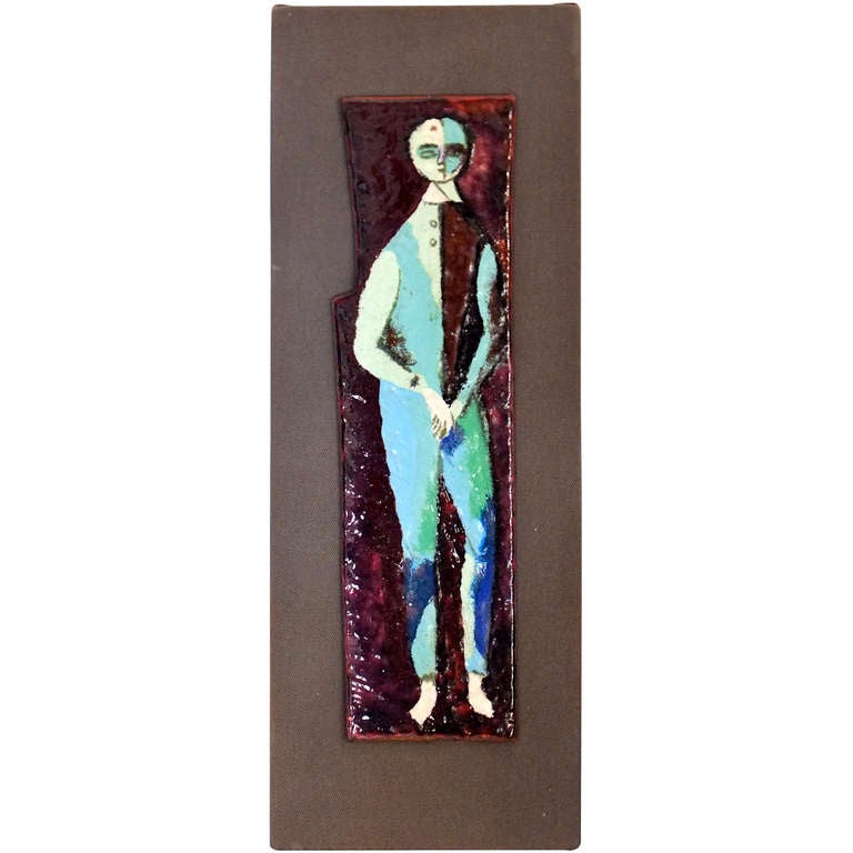 Enameled copper sheet mounted on canvas wrapped board with a painting depicting the harlequin style costume of a standing male figure.  Signed on reverse by the artist, Bruno Santini of Venezia. There is a label from the 1954 Biennale Internazionale