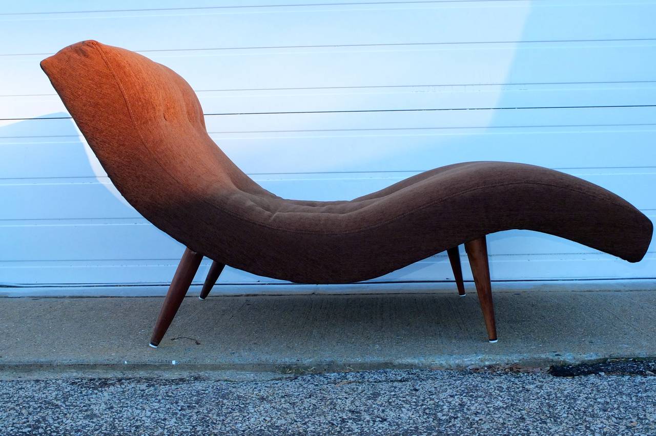 Vintage 1960's contour sculpted wave chaise lounge by Adrian Pearsall for Craft Associates, with splayed tapered walnut legs recently re-upholstered in brown chennile and button tufts.