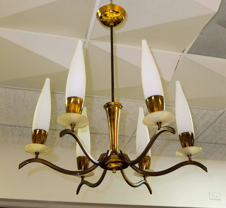 Six arm brass candelabra chandelier with six Italian torpedo shaped white opaline glass diffusors, and frosted acrylic bobeche, very much in the style of an Arredoluce chandelier by Angelo Lelii.