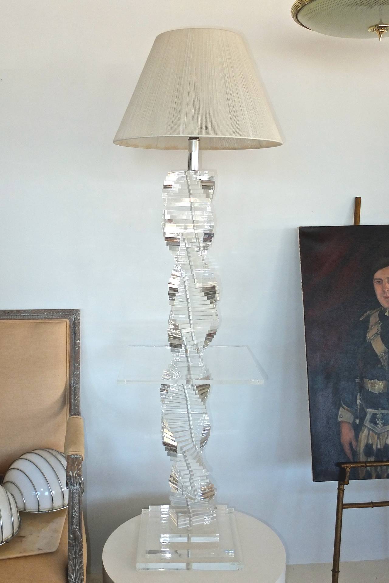 Vintage lucite helix-form stacked blocks floor lamp with a 15 inch square lucite table top at 23 inches high. Chrome fittings. Stepped three tier lucite slab base. In the style of Karl Springer.

Total height 60 inches to top of finial.  48 inches