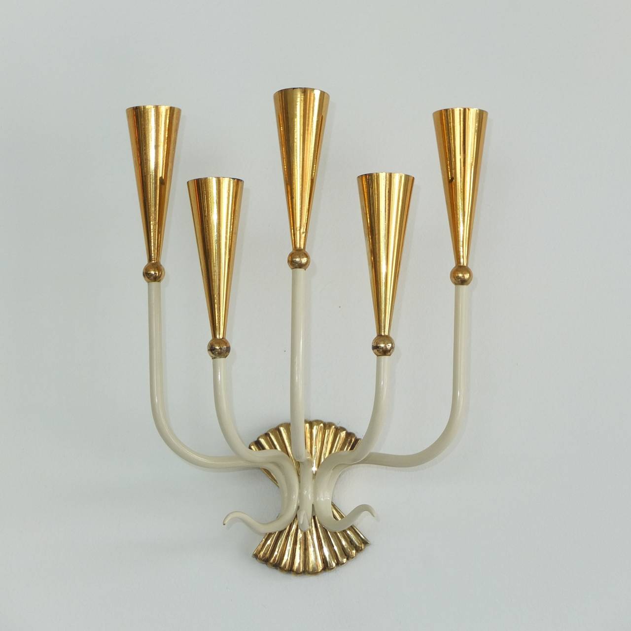 Extraordinary pair of nuova-classical 5 arm sconces in the manner of Paolo Buffa.

Each takes five candelabra screw socket bulbs. See detail images with a variety of bulbs.
