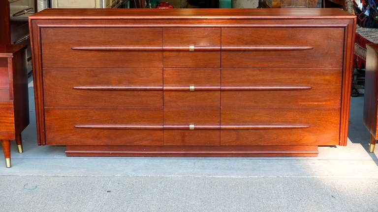 Elegant mahogany and brass nine drawer long dresser (with mirror) from the Viscount collection made by Gibbard Furniture Company of Canada in March 1956.  Only 60 were made.

The Viscount was advertised as the ultimate in Gibbard modern furniture.