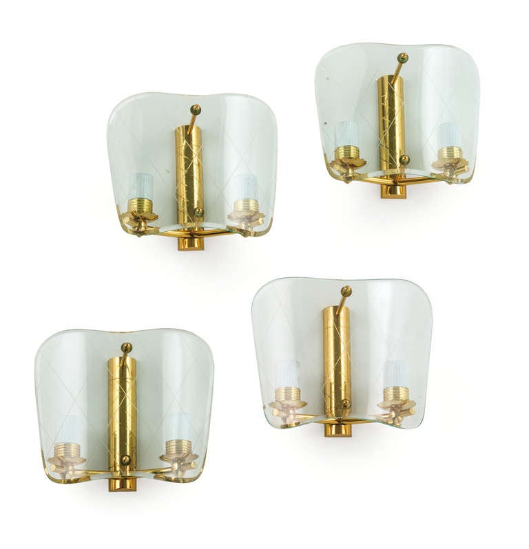 We have a total of four pair of these sconces, Model No. 307 from the 1950 G.C.M.E. production catalog.

The curved glass is engraved with a diamond cross hatch design as is the vertical gilt brass post.

Two brass pins extend from the post