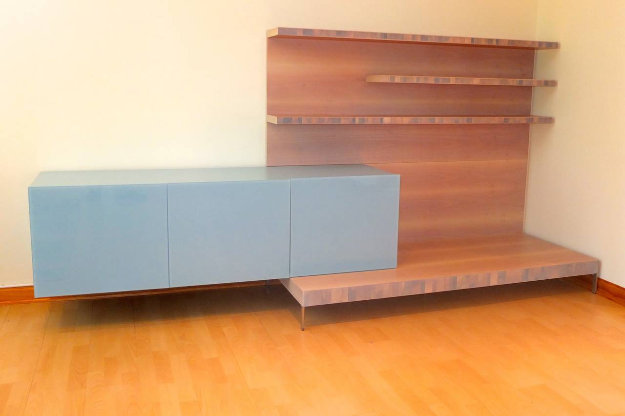 Clever modern Italian storage design by Daniele Lago from his 2003 36E8 collection for Lago.
The floating credenza appears to defy gravity while counterbalanced from the base of the shelving unit while supported by a hidden wall-mounted L