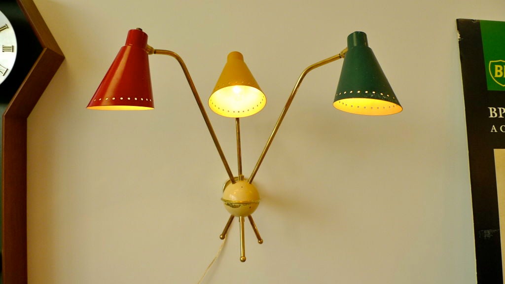 Extremely rare grand scale wall lamp with three brass arms and tri-colour articulating cone lights by M. Kobis & R. Lorence, France 1953.

ref: Mobilier et Decoration 1953 No. 8 juillet - aout. 

Presented in excellent original vintage condition. 