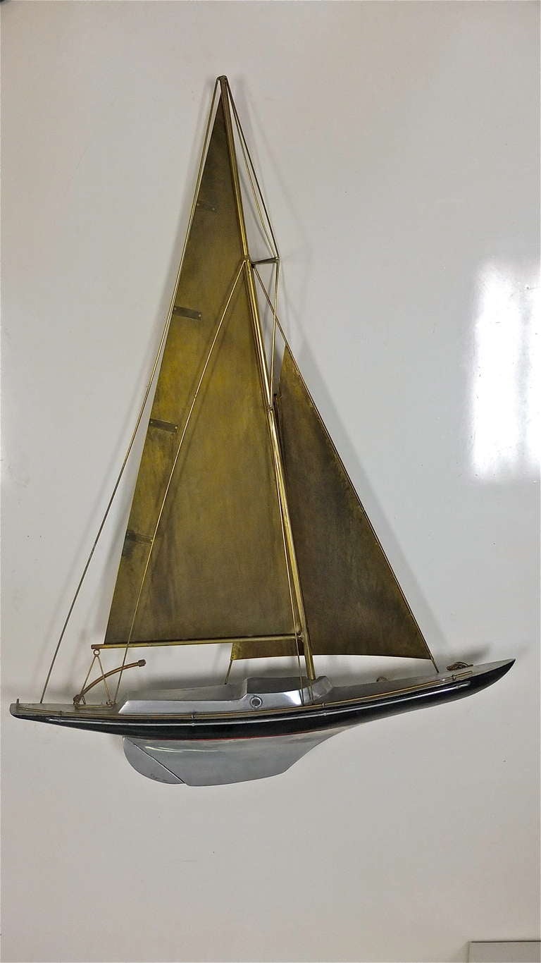 Signed and dated C. Jere sailing yacht in crafted metals.  

Hangs on wall with three hooks.

Original vintage patina.