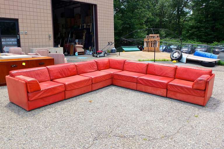 American Leather 7 piece sectional sofa in burnt orange/brick red leather.  Each section is the same size.  Includes one corner module and two single armed modules.  This is great casual and comfortable seating, The leather has been broken in over