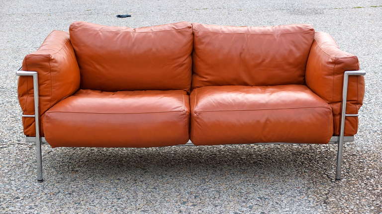 Vintage love seat sofa in the style of Corbusier's LC3 with down filled leather cushions.

Matching lounge chair available as well.......see separate listing
