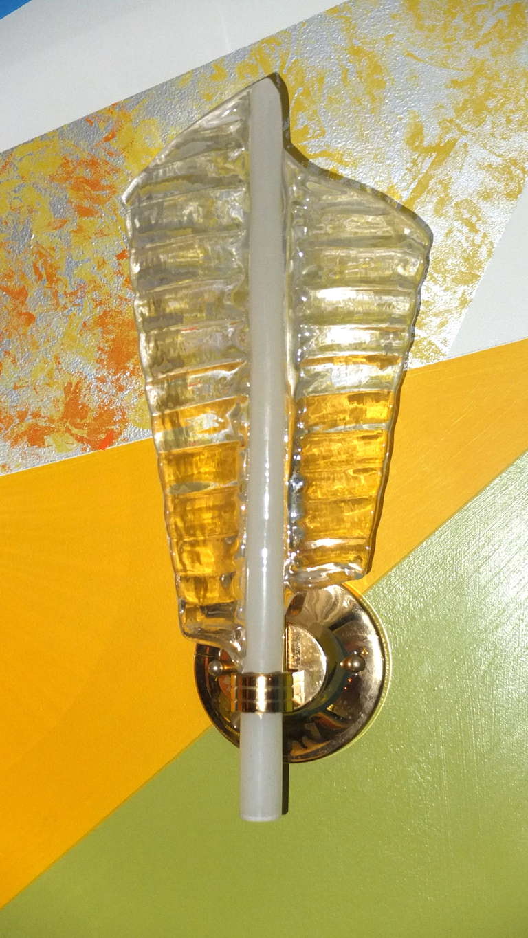 Artisan crafted mouth blown Murano glass wall sconces in the form of a feather by Barovier & Toso, signed. Custom machined brass mounts.  Ready to install.  Takes a single tubular bulb with standard Edison screw socket.  Ready to mount.