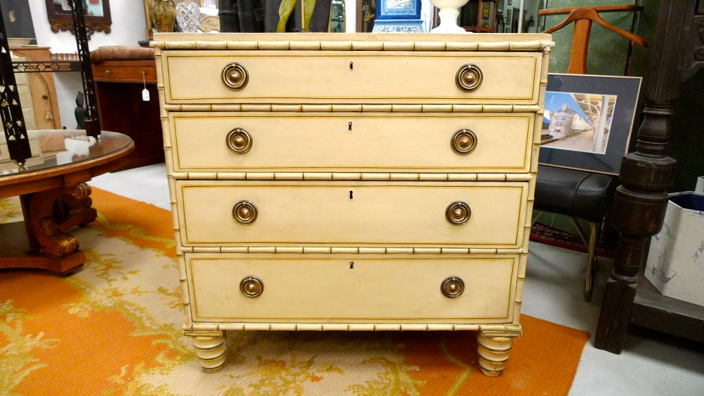Antique English faux bamboo four drawer with painted finish.