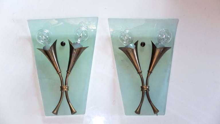 Pair of early 1950's Italian sconces in the style of Pietro Chiesa for Fontana Arte and attributed to Santambrogio e De Berti in elegantly sculpted bronze in the form of a bouquet of petite trumpet or calla lily flowers.  These are mounted to aqua