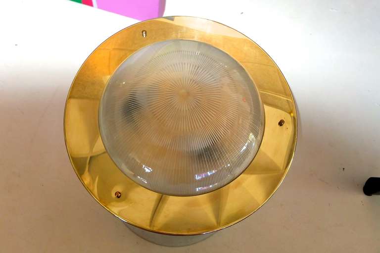Due to a mishap there is a small crack in the glass, therefore the price is substantially reduced.  No further discounts.

Vintage 1960's Italian flush mounted ceiling lamp in round flying saucer form with domed holophane glass.  Impressive heft