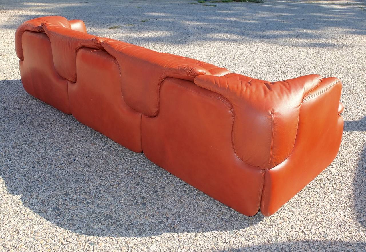 An important sofa designed by the Italian architect, Alberto Rosselli in 1972 for Saporiti Italia.  It is one of the first modular sofas ever produced for private homes. Polyurethane injected foam foam and steel frame with twin stitched leather