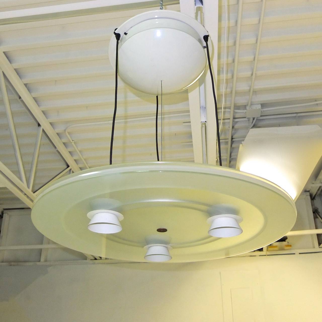 This is the Aurora pendant in the very rare color white.  It also came in black and blue.

Perry King & Santiago Miranda designed the 'Aurora' pendant light in 1982 for Arteluce, which became a division of FLOS.

The Aurora provides direct and