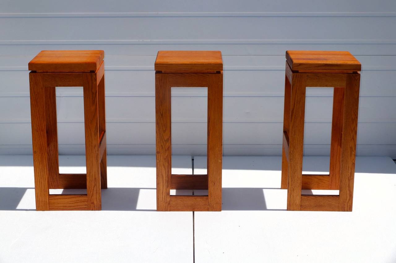 Set of six vintage solid butcher block bar stools custom made by Heinrich Savelberg of Woodstock, VT circa 1977.  

Brand mark under each seat reads 